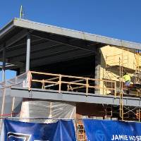 A photo of the outside of the Jamie Hosford Football Center under construction.